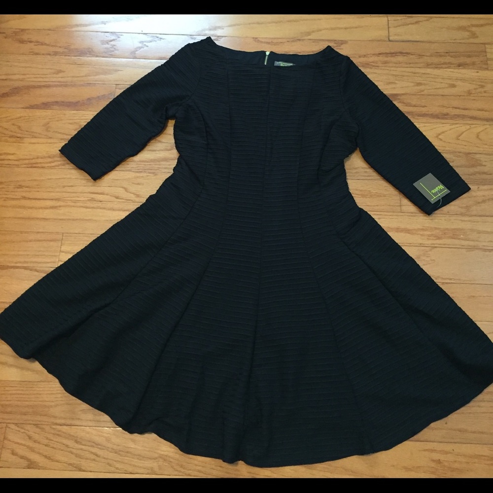 Black 3/4 sleeve fit and flare dress.